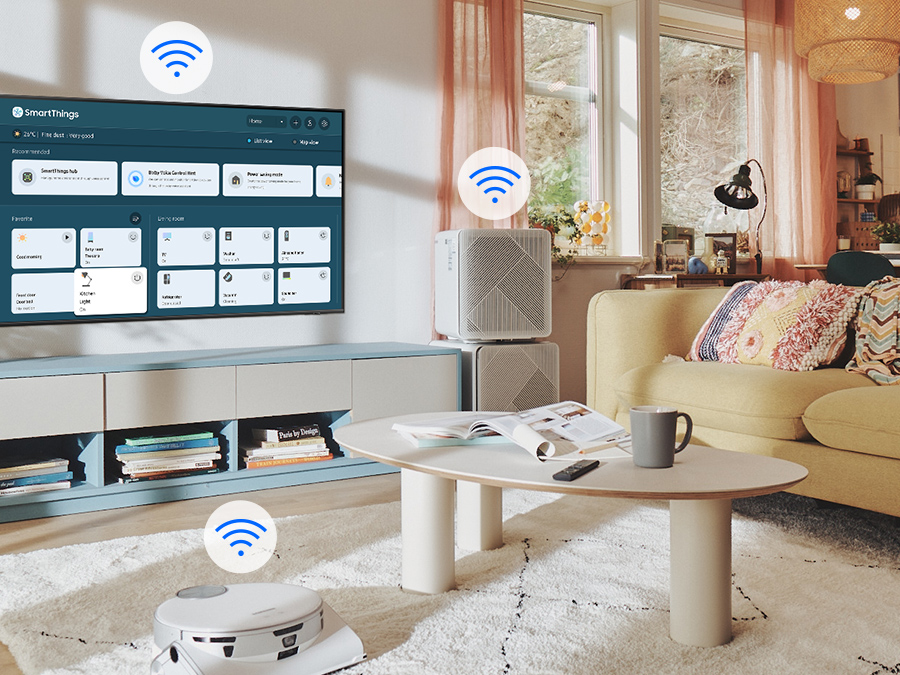 The SmartThings UI is on display on the TV. WiFi icons are floating on top of the TV, vacuum robot and air purifier.
