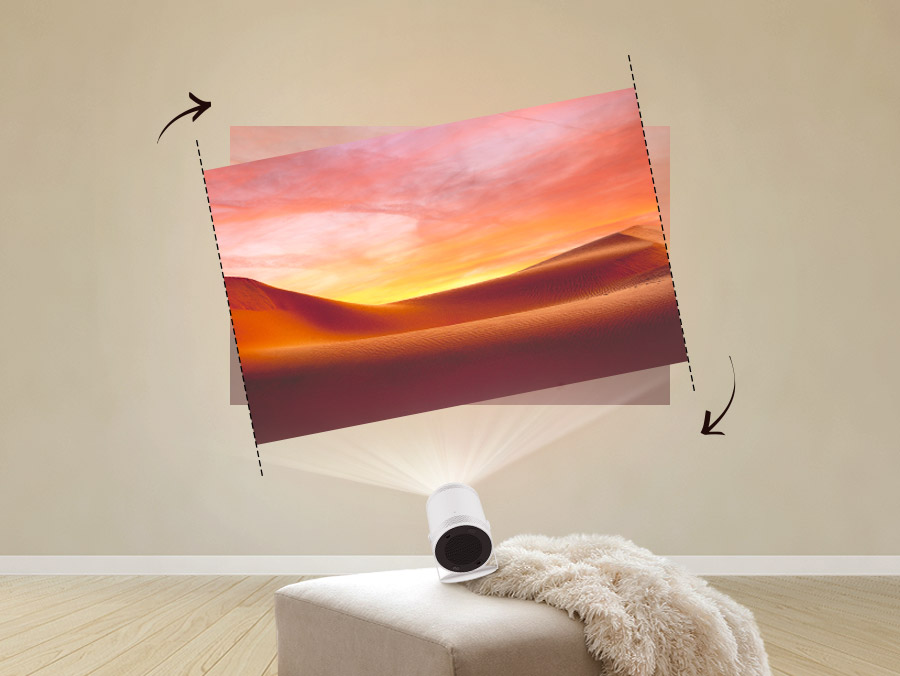 The Freestyle on an uneven couch casts a crooked picture of a sand dune on the wall. The picture automatically adjusts into a level picture.